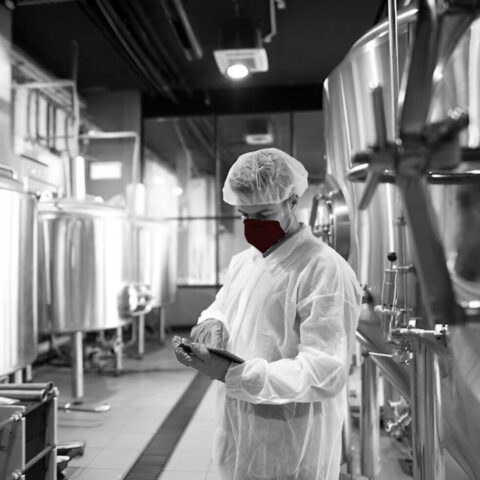 professional-technologist-using-tablet-production-plant-checking-productivity-quality_342744-1162